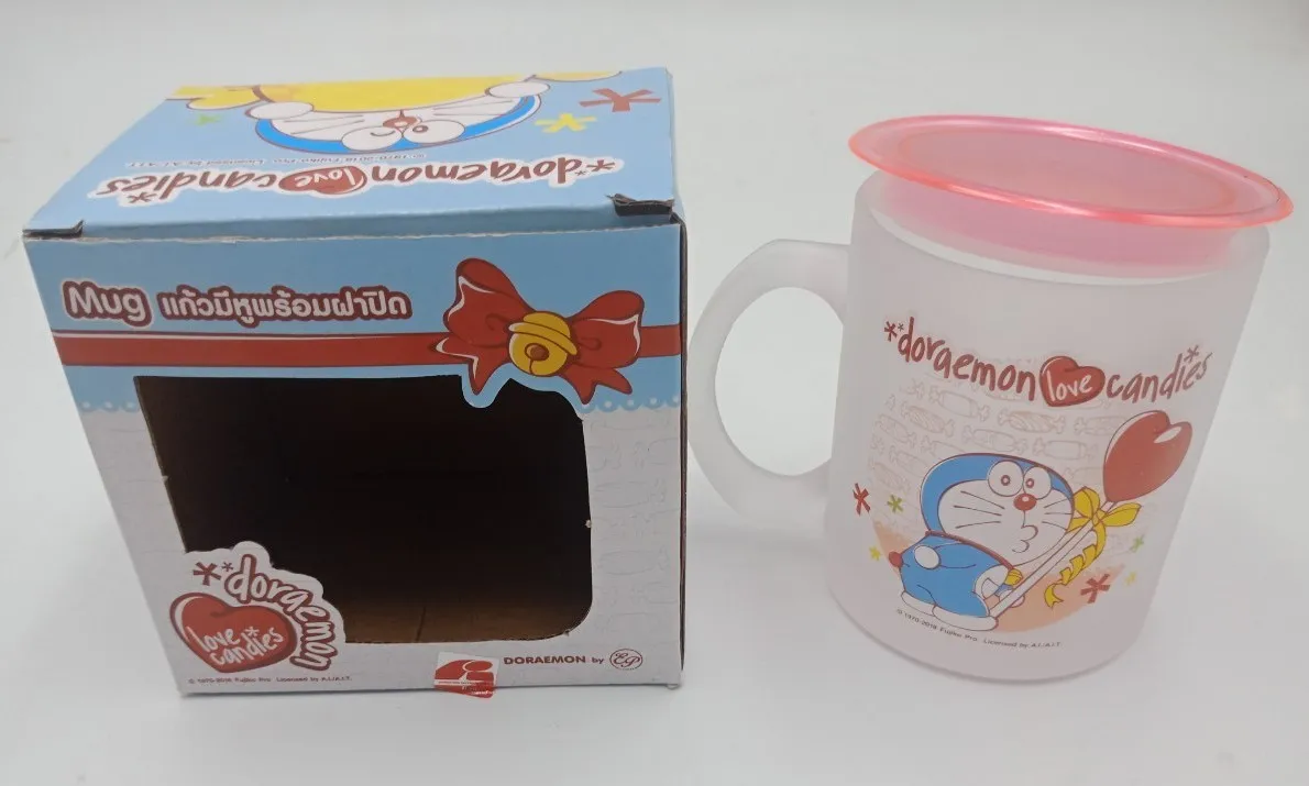 แก้วพ่นทรายทรงเตี้ย+ฝาปิด DORAEMON(1*60)ลิขสิทธ์ถูกต้อง (ขายยกลัง)